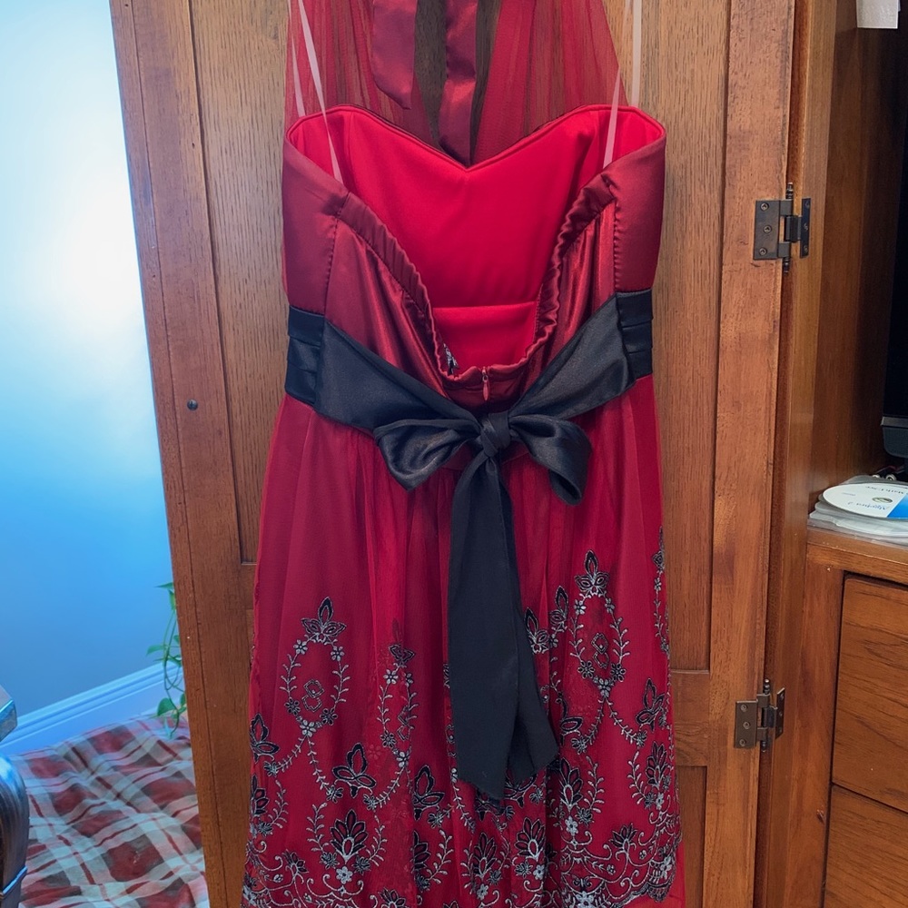 Short, red dress with black details